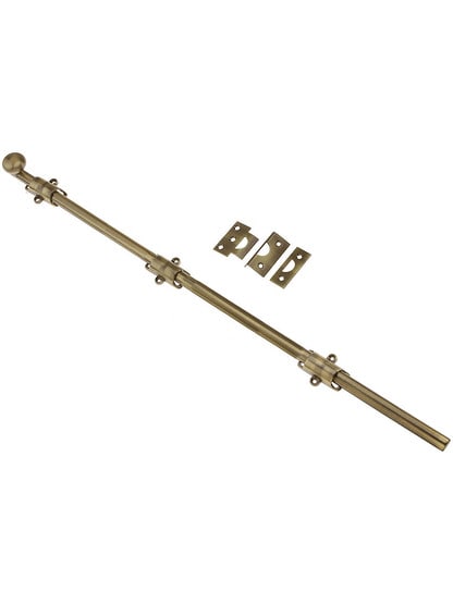 24 inch Traditional Style Surface Door Bolt in Antique Brass Finish.